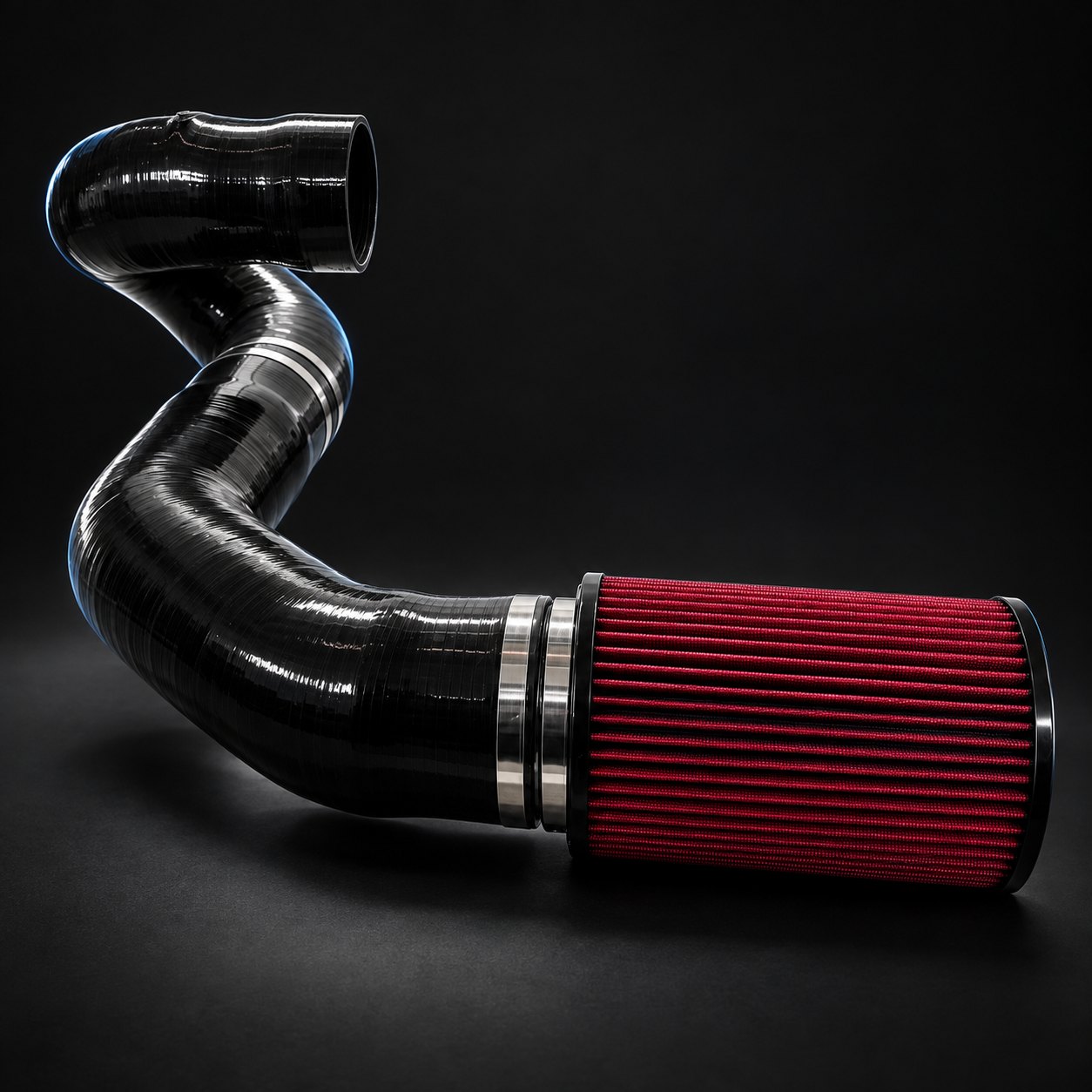 B58 front mount intake with a black silicone tube and a red conical filter