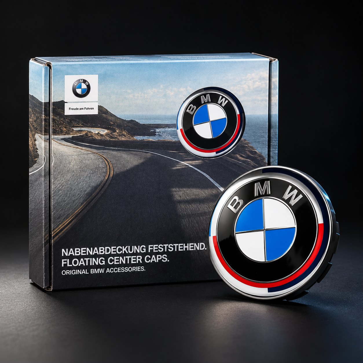 Genuine BMW floating center cap with the anniversary roundel, shown with its original BMW Accessories box