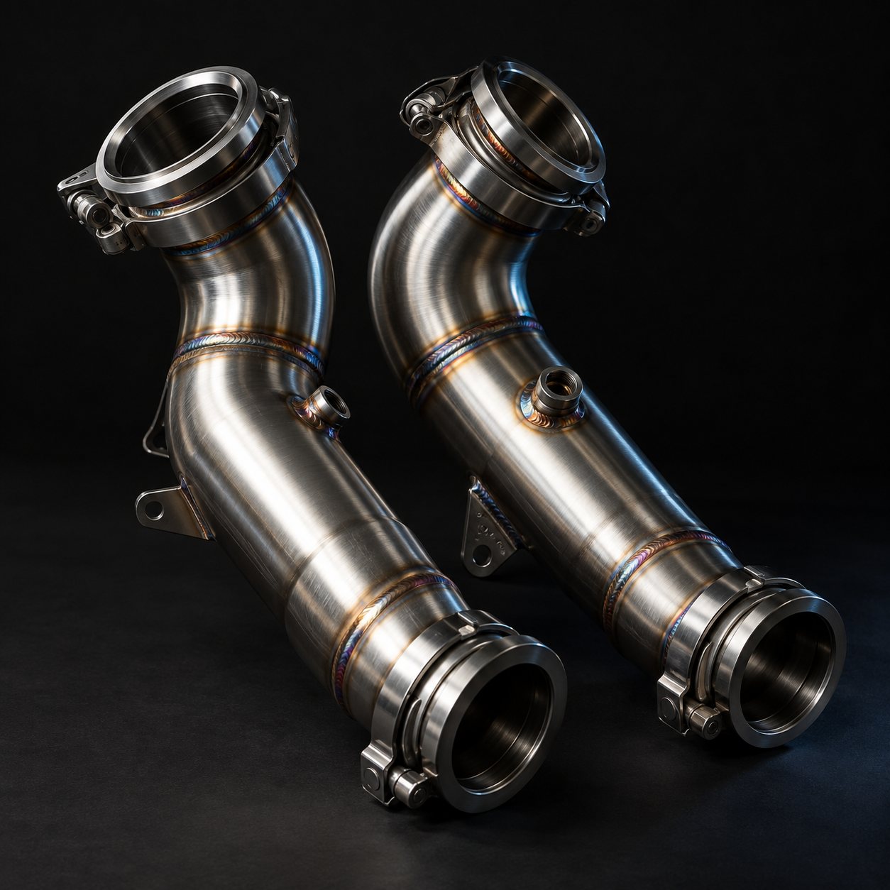Pair of stainless steel downpipes with V-band clamps