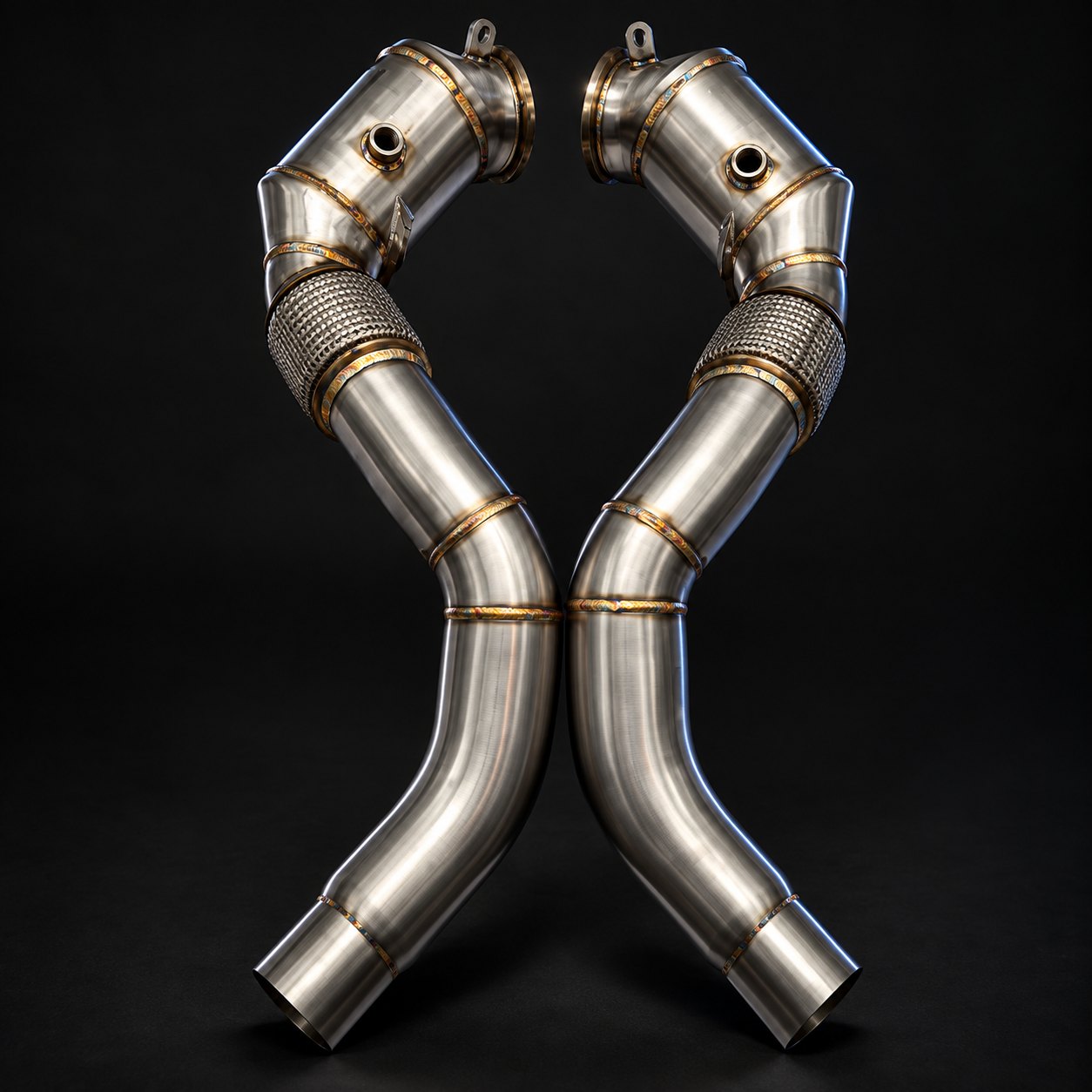 Pair of brushed stainless N63TU3 downpipes with braided flex sections, hanger tabs and oxygen sensor bungs