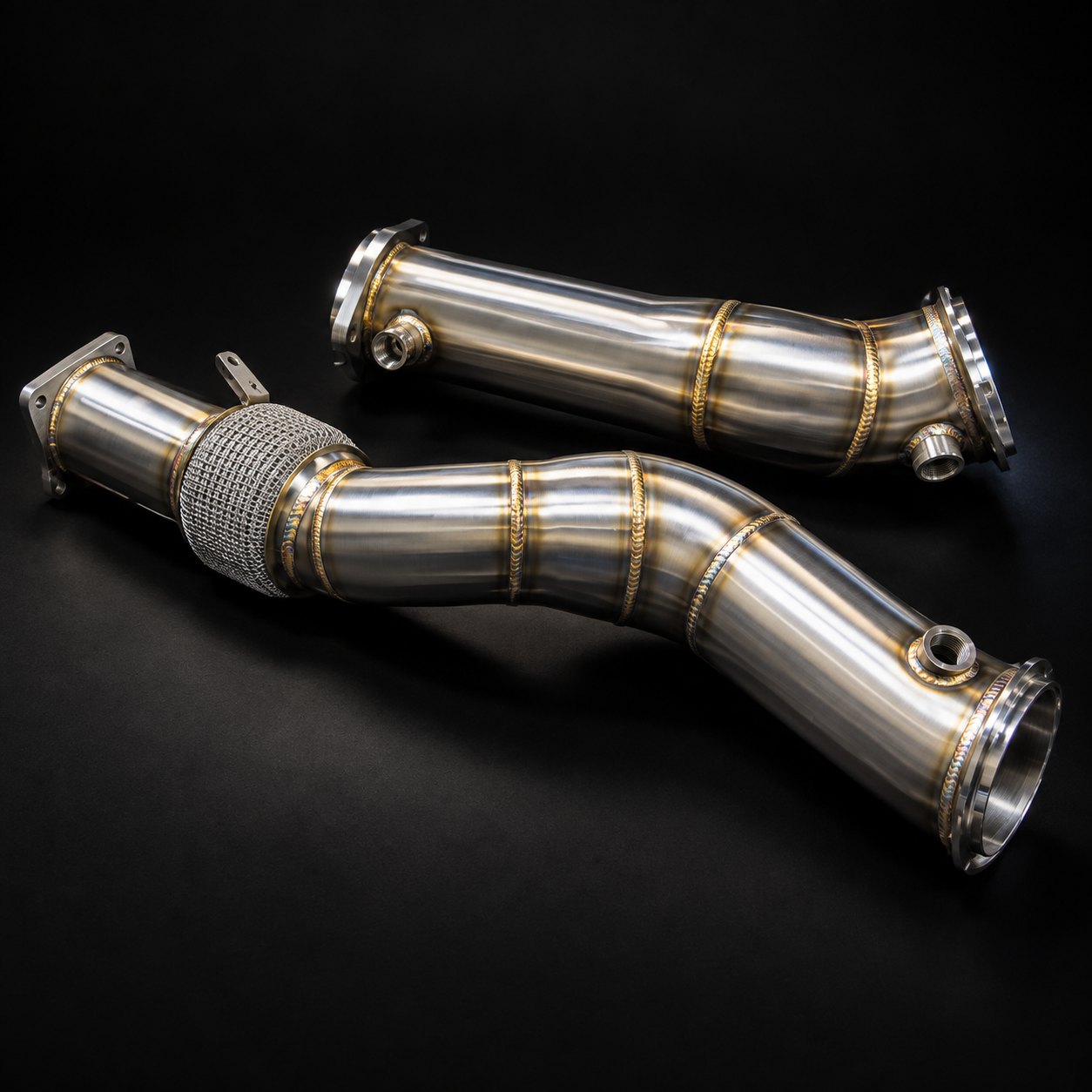 Pair of brushed stainless steel S58 downpipes with V-band flanges, a braided flex section and oxygen sensor bungs