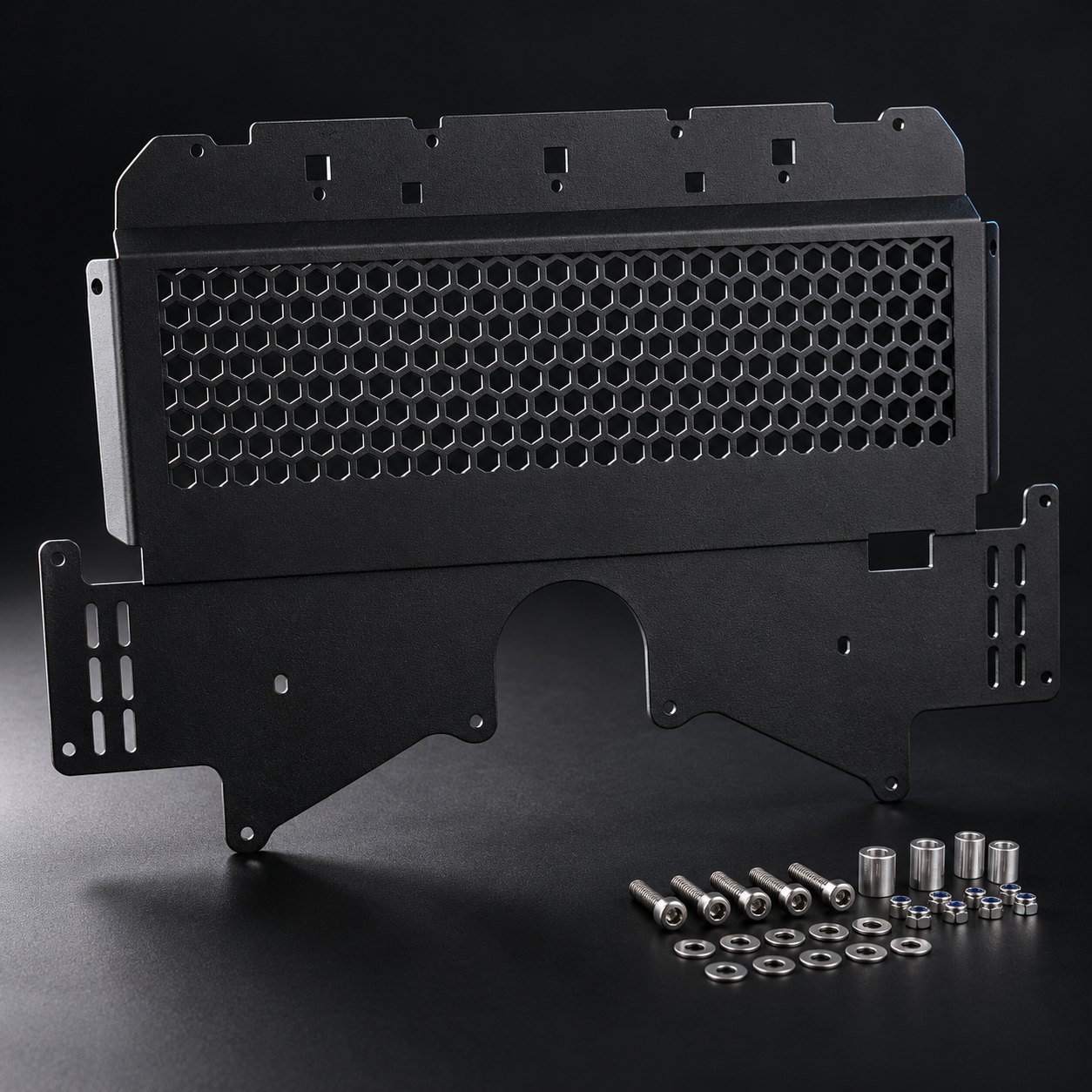Black S58 oil cooler guard with a honeycomb mesh screen, shown with its stainless mounting hardware